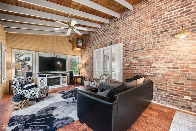 115 Jordan Rd, Indianapolis, IN 46217 - living room with brick wall, a wooden ceiling with exposed beams, wood finished floors, a ceiling fan, and a towering ceiling