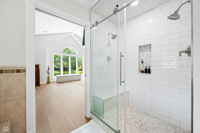 115 Jordan Rd, Indianapolis, IN 46217 - full bath featuring a stall shower, wood finished floors, and lofted ceiling