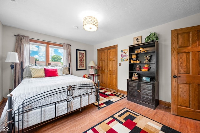 115 Jordan Rd, Indianapolis, IN 46217 - bedroom featuring light wood-style flooring and baseboards