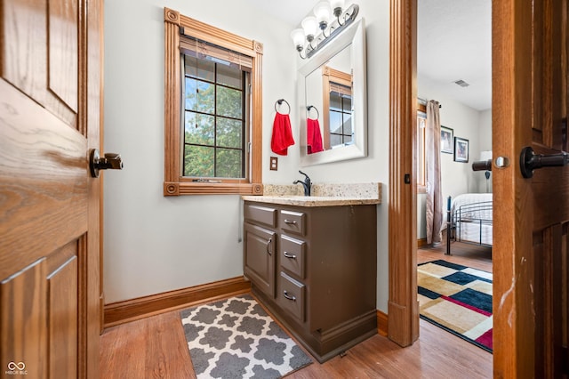 115 Jordan Rd, Indianapolis, IN 46217 - ensuite bathroom featuring vanity and wood finished floors