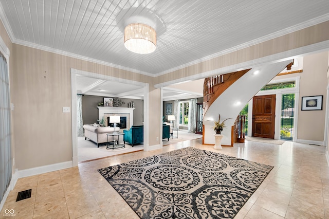115 Jordan Rd, Indianapolis, IN 46217 - entryway with crown molding, tile patterned floors, and a fireplace