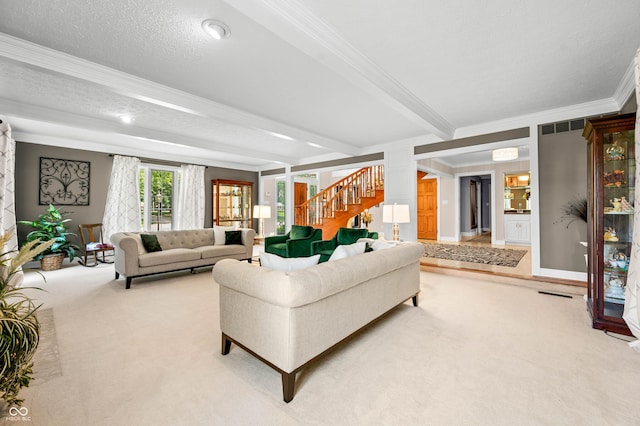 115 Jordan Rd, Indianapolis, IN 46217 - living area with crown molding, carpet floors, stairway, and beamed ceiling