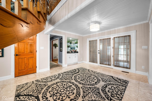 115 Jordan Rd, Indianapolis, IN 46217 - tiled entrance foyer with crown molding, plenty of natural light, and french doors