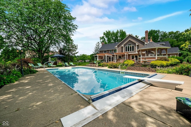 115 Jordan Rd, Indianapolis, IN 46217 - outdoor pool with a diving board, a gazebo, and a patio