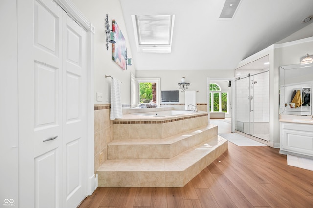115 Jordan Rd, Indianapolis, IN 46217 - full bath featuring lofted ceiling, a bath, a stall shower, healthy amount of natural light, and vanity