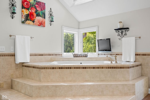 115 Jordan Rd, Indianapolis, IN 46217 - full bath featuring a bath, high vaulted ceiling, and a skylight