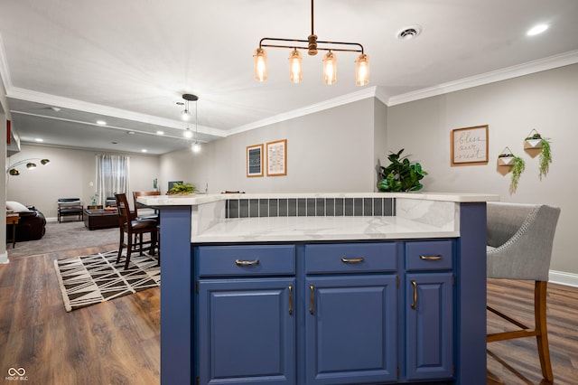 115 Jordan Rd, Indianapolis, IN 46217 - kitchen featuring blue cabinets, open floor plan, a kitchen breakfast bar, crown molding, and dark wood finished floors