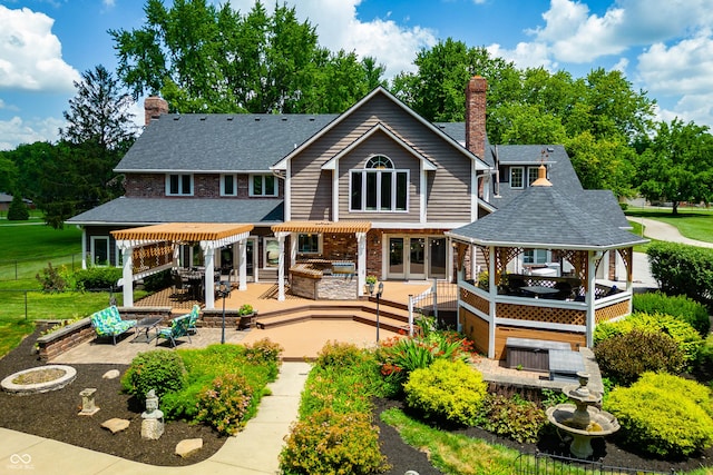 115 Jordan Rd, Indianapolis, IN 46217 - back of property with a pergola, a chimney, a patio area, and a gazebo