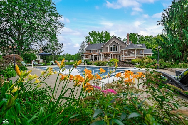 115 Jordan Rd, Indianapolis, IN 46217 - swimming pool featuring a wooden deck