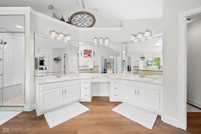 115 Jordan Rd, Indianapolis, IN 46217 - full bath featuring a shower stall, two vanities, and wood finished floors