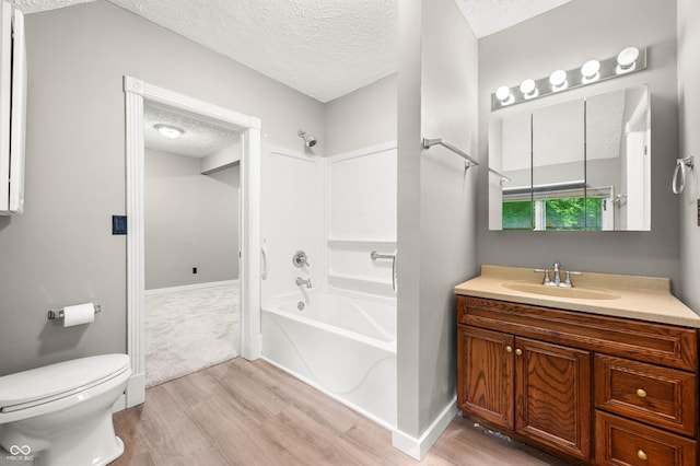115 Jordan Rd, Indianapolis, IN 46217 - bathroom featuring a textured ceiling, wood finished floors, vanity, and shower / bathtub combination