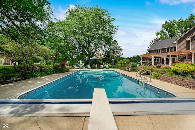 115 Jordan Rd, Indianapolis, IN 46217 - view of pool featuring a pergola, a diving board, and a patio