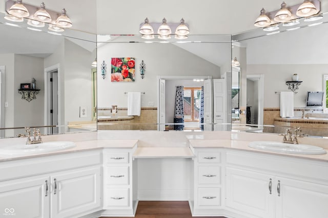 115 Jordan Rd, Indianapolis, IN 46217 - full bathroom featuring two vanities, backsplash, and lofted ceiling