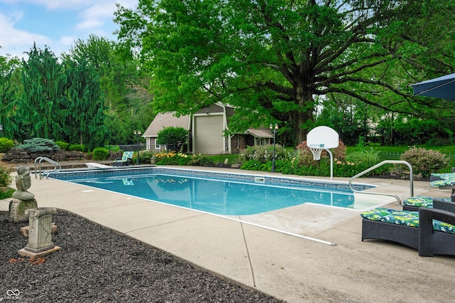 115 Jordan Rd, Indianapolis, IN 46217 - outdoor pool with a patio area and a storage unit