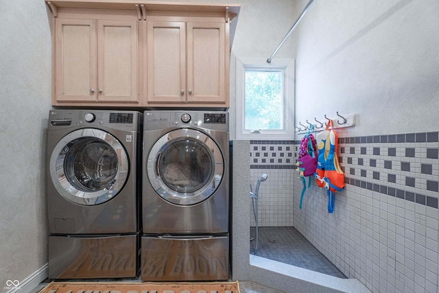 13299 W Wildflower Dr, Columbus, IN 47201 - laundry area featuring washer and dryer and cabinet space