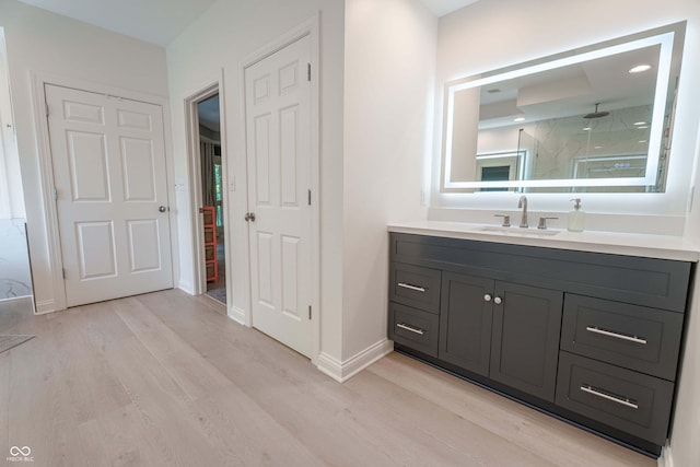 13299 W Wildflower Dr, Columbus, IN 47201 - bathroom with wood finished floors, vanity, and a marble finish shower
