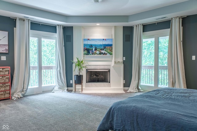 13299 W Wildflower Dr, Columbus, IN 47201 - bedroom featuring carpet flooring, access to exterior, and multiple windows