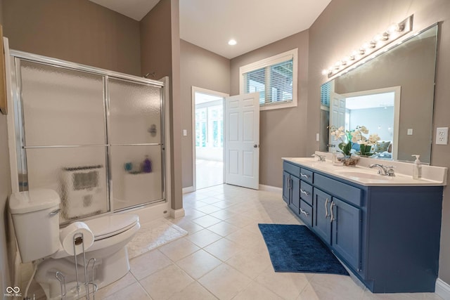 13299 W Wildflower Dr, Columbus, IN 47201 - full bathroom featuring double vanity, a shower with door, tile patterned flooring, and recessed lighting