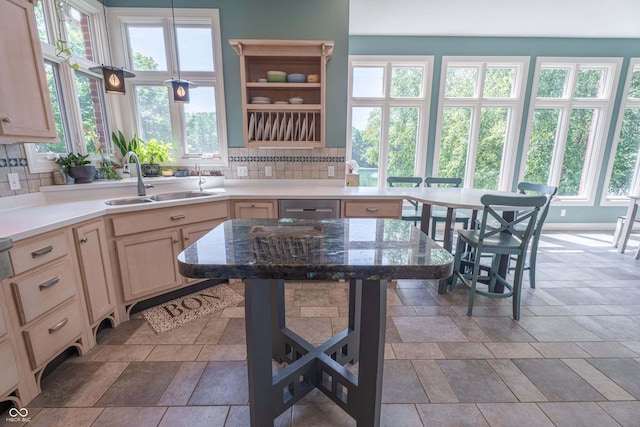 13299 W Wildflower Dr, Columbus, IN 47201 - kitchen with tasteful backsplash, stone tile floors, and light brown cabinetry