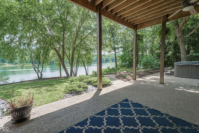 13299 W Wildflower Dr, Columbus, IN 47201 - view of patio with a hot tub, a water view, a ceiling fan, and view of scattered trees