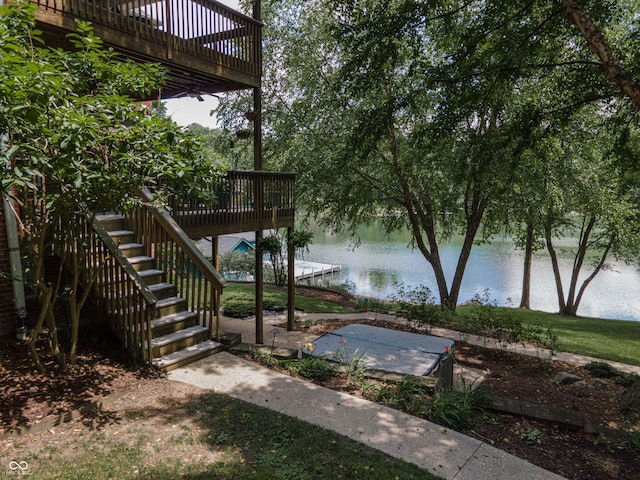13299 W Wildflower Dr, Columbus, IN 47201 - view of patio / terrace featuring stairway and a deck with water view