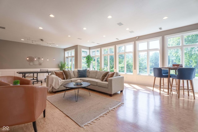 13299 W Wildflower Dr, Columbus, IN 47201 - living room with light wood finished floors, recessed lighting, and a wainscoted wall