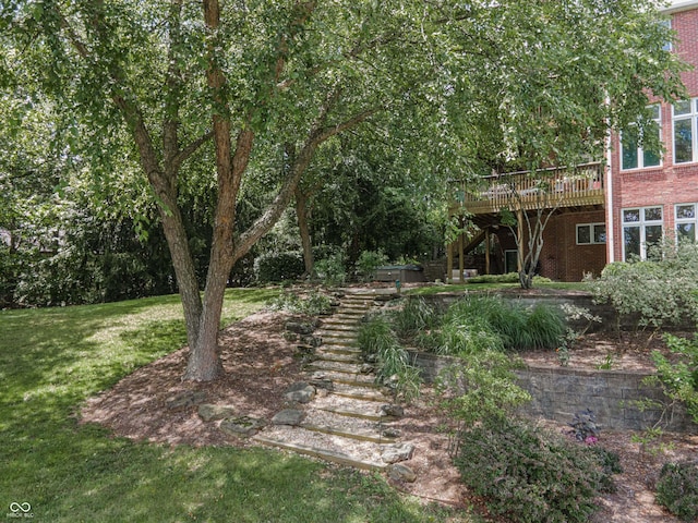 13299 W Wildflower Dr, Columbus, IN 47201 - view of grassy yard with stairs and a wooden deck