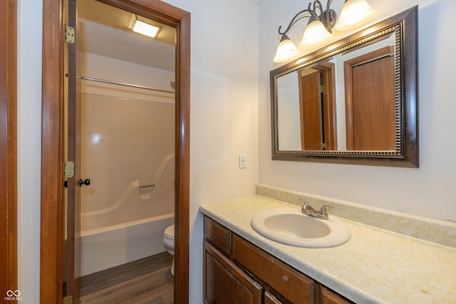4823 Tempe Ct, Indianapolis, IN 46241 - bathroom with vanity, wood finished floors, and shower / bathtub combination