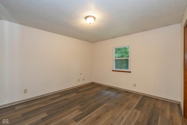 4823 Tempe Ct, Indianapolis, IN 46241 - spare room featuring dark wood finished floors and a textured ceiling