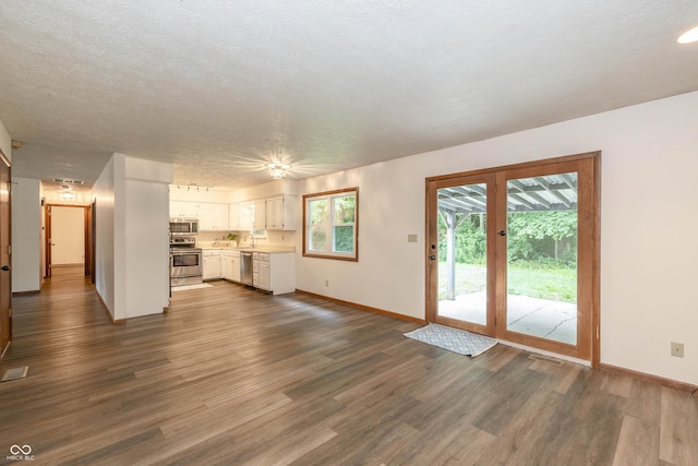 4823 Tempe Ct, Indianapolis, IN 46241 - unfurnished living room with a sink and dark wood-style floors