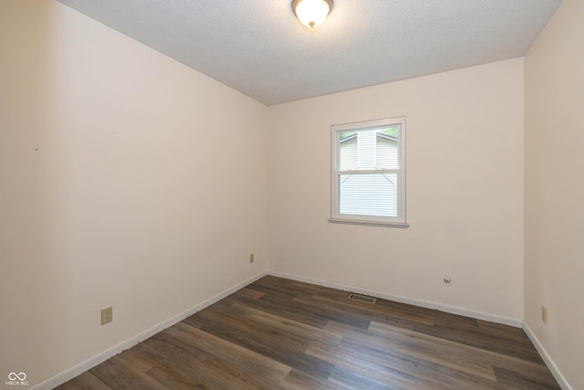 4823 Tempe Ct, Indianapolis, IN 46241 - spare room with dark wood-type flooring and baseboards