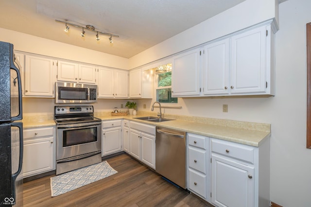 4823 Tempe Ct, Indianapolis, IN 46241 - kitchen with stainless steel appliances, dark wood-type flooring, white cabinets, and light countertops