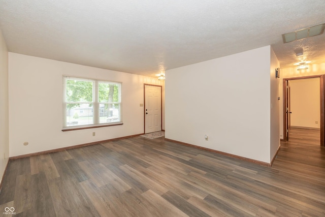 4823 Tempe Ct, Indianapolis, IN 46241 - empty room featuring wood finished floors and a textured ceiling