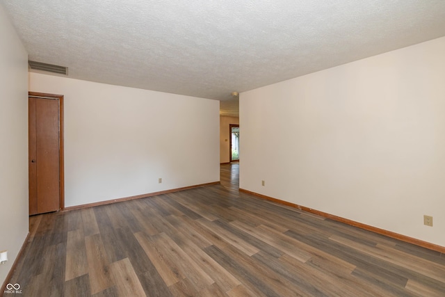 4823 Tempe Ct, Indianapolis, IN 46241 - spare room with dark wood-style flooring and a textured ceiling
