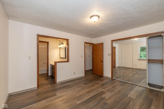 4823 Tempe Ct, Indianapolis, IN 46241 - unfurnished bedroom with wood finished floors, a textured ceiling, and a closet
