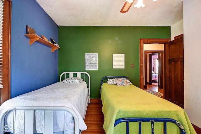 1934 N New Jersey St, Indianapolis, IN 46202 - bedroom with wood finished floors, a textured ceiling, and ceiling fan