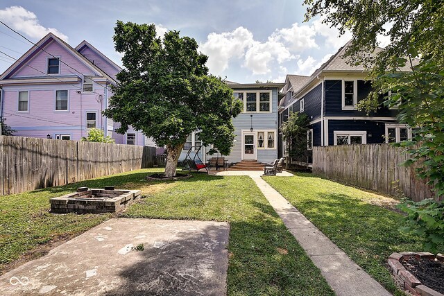 1934 N New Jersey St, Indianapolis, IN 46202 - fenced backyard featuring a patio area and entry steps