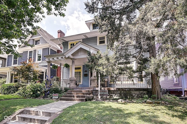 1934 N New Jersey St, Indianapolis, IN 46202 - view of front of property with covered porch and a front yard