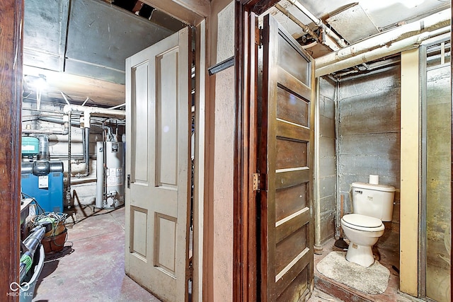 1934 N New Jersey St, Indianapolis, IN 46202 - bathroom with gas water heater and unfinished concrete floors
