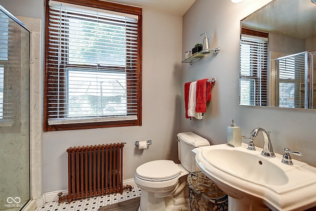 1934 N New Jersey St, Indianapolis, IN 46202 - bathroom featuring radiator, healthy amount of natural light, and a shower stall
