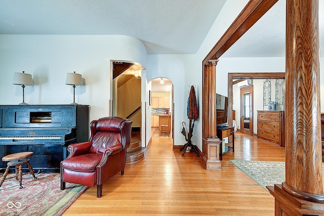 1934 N New Jersey St, Indianapolis, IN 46202 - living area with arched walkways, light wood finished floors, and decorative columns