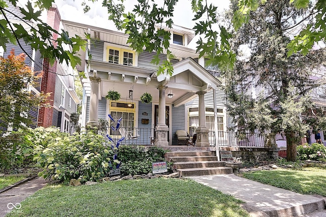 1934 N New Jersey St, Indianapolis, IN 46202 - view of front of home with covered porch and a front lawn