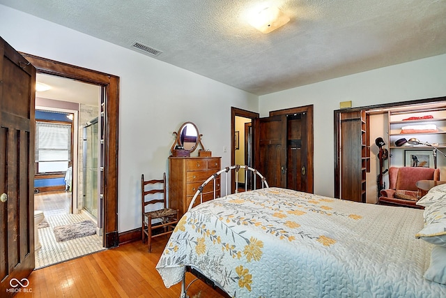 1934 N New Jersey St, Indianapolis, IN 46202 - bedroom featuring light wood finished floors and a textured ceiling