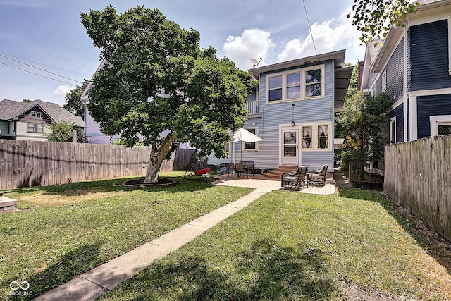 1934 N New Jersey St, Indianapolis, IN 46202 - rear view of property with entry steps, a patio, and a fenced backyard