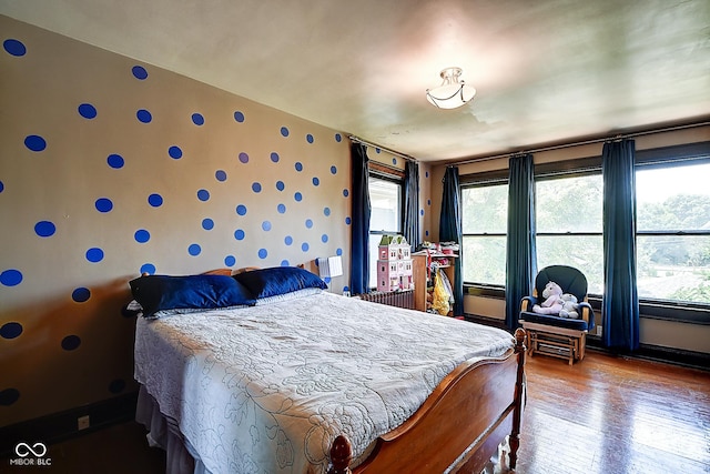 1934 N New Jersey St, Indianapolis, IN 46202 - bedroom with wallpapered walls, wood-type flooring, and multiple windows