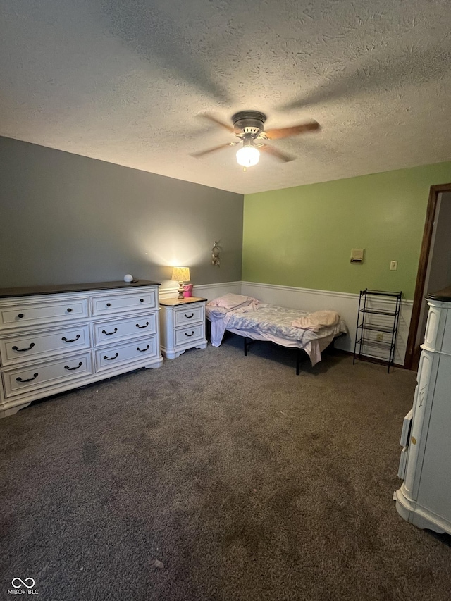 10308 Stormhaven Way, Indianapolis, IN 46256 - bedroom featuring dark carpet, a textured ceiling, and a ceiling fan