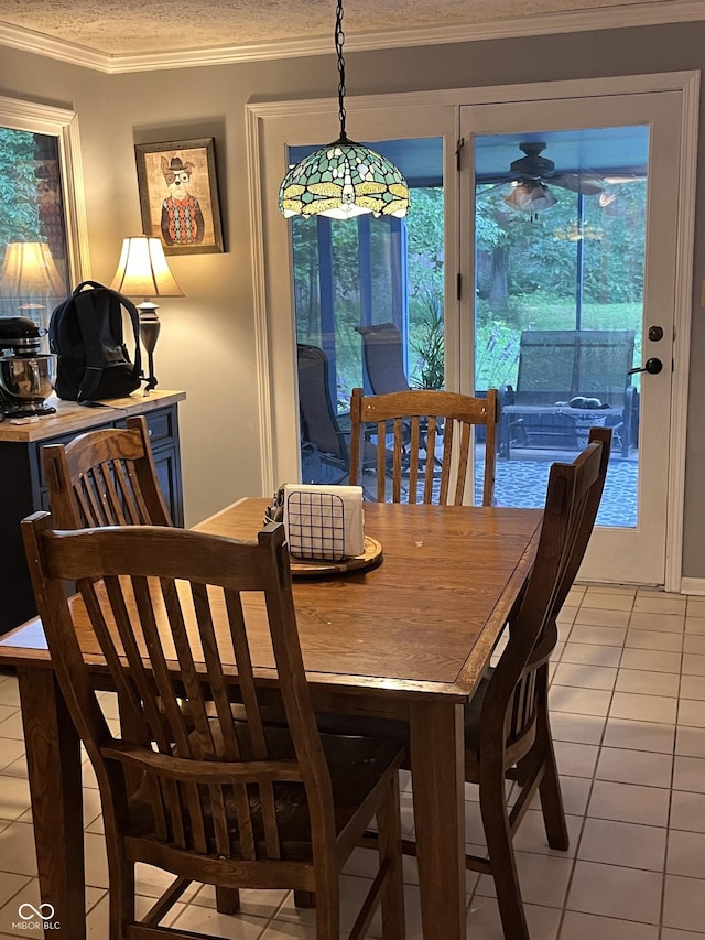 10308 Stormhaven Way, Indianapolis, IN 46256 - dining space with light tile patterned floors, healthy amount of natural light, crown molding, and ceiling fan