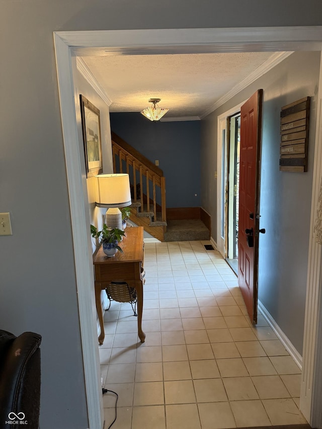 10308 Stormhaven Way, Indianapolis, IN 46256 - hallway with crown molding, stairs, light tile patterned floors, and a chandelier