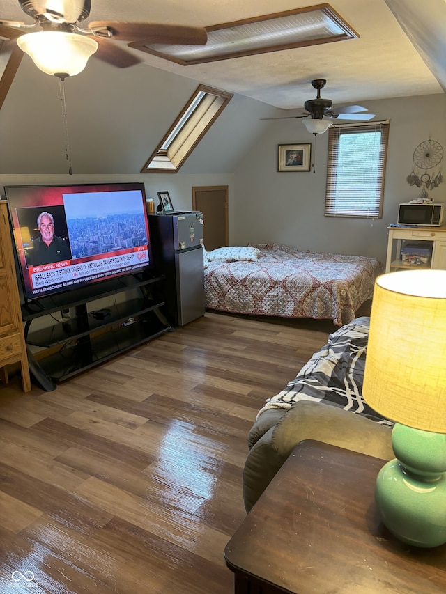 10308 Stormhaven Way, Indianapolis, IN 46256 - bedroom with wood finished floors, lofted ceiling, a ceiling fan, and a skylight