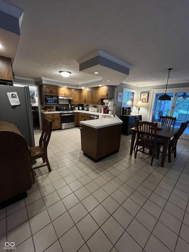 10308 Stormhaven Way, Indianapolis, IN 46256 - kitchen with stainless steel appliances, light countertops, a peninsula, light tile patterned floors, and a textured ceiling